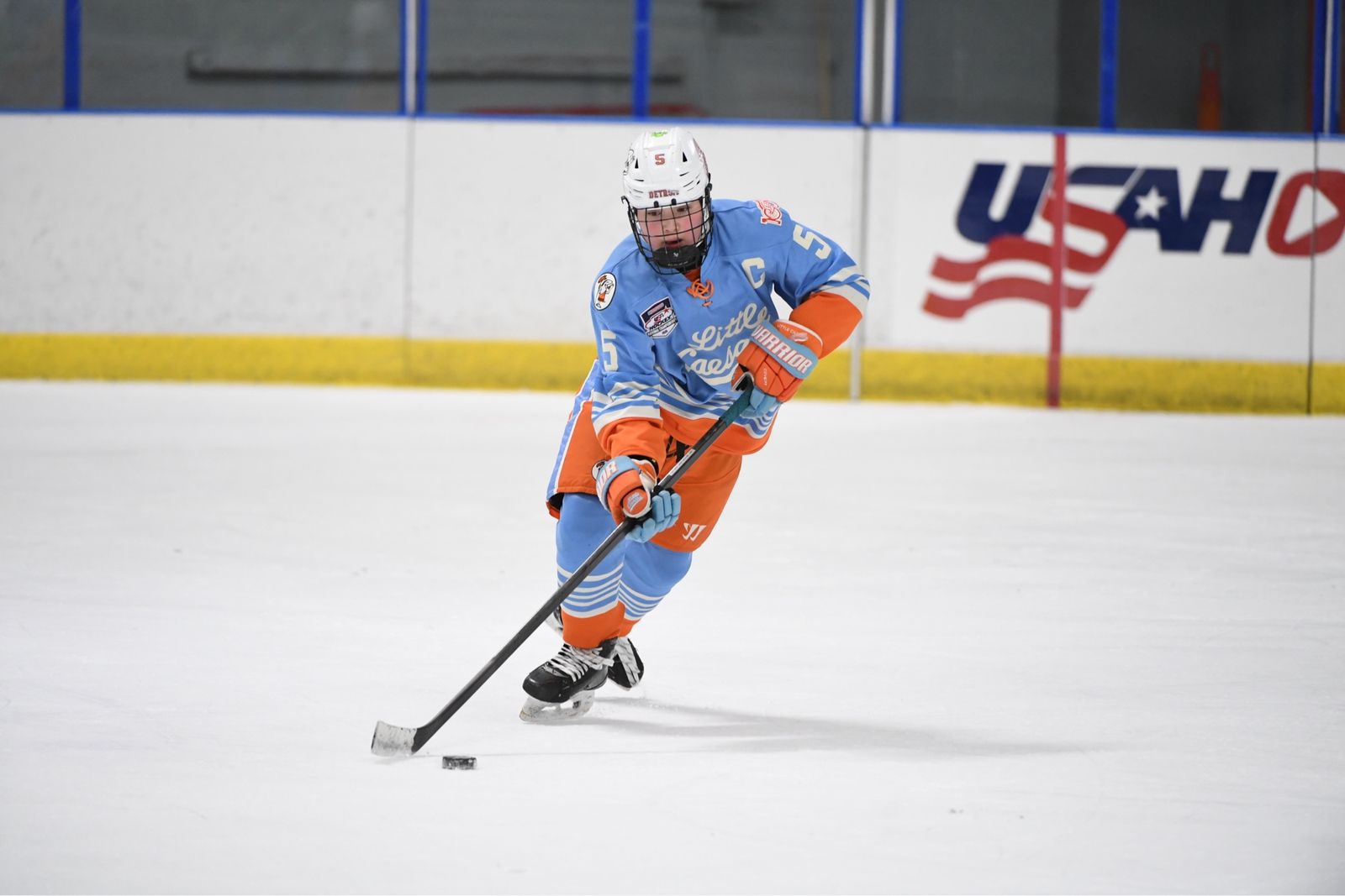 Cameron Cadena skating with the puck in transition